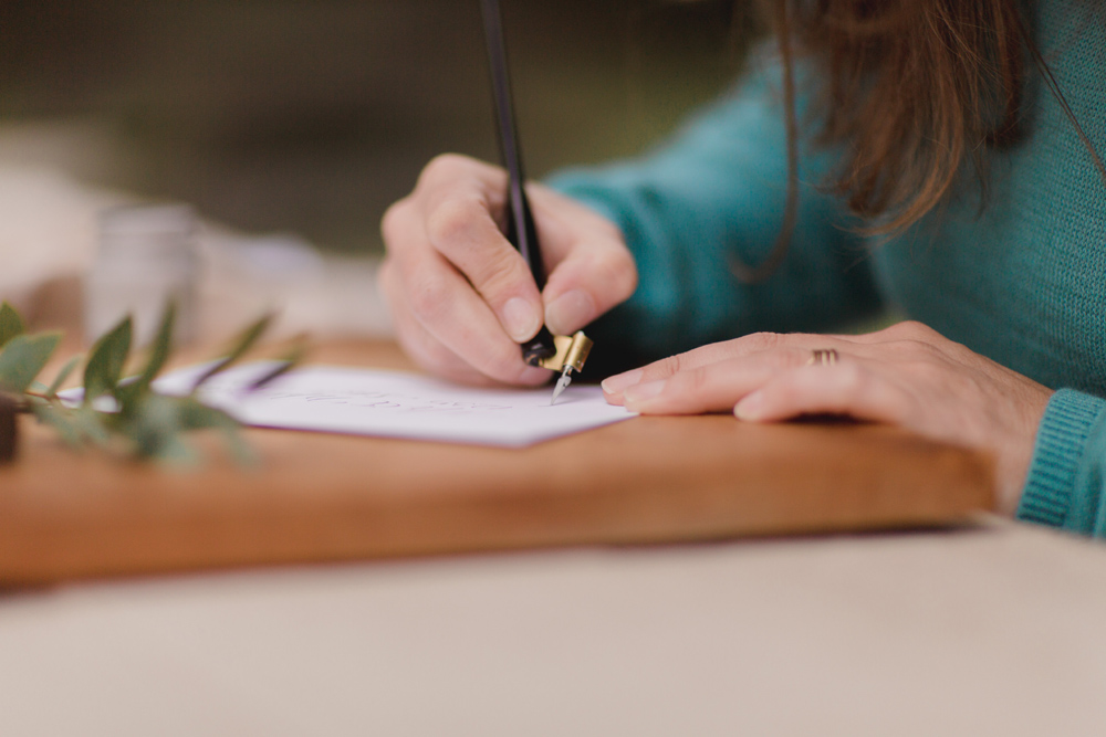 Wedding calligrapher creating bespoke wedding stationary