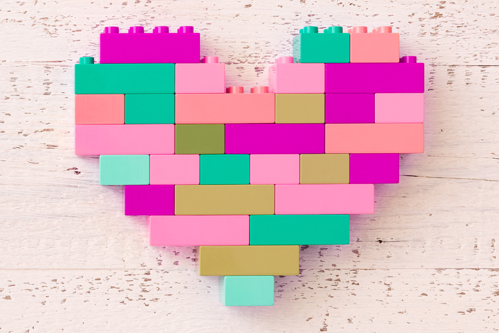 Heart made out of pink and green lego