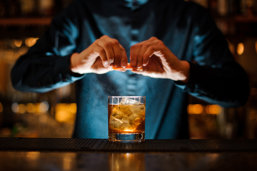Bartender making a whisky cocktail