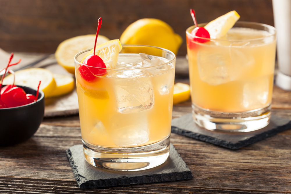 Two whisky sour cocktails