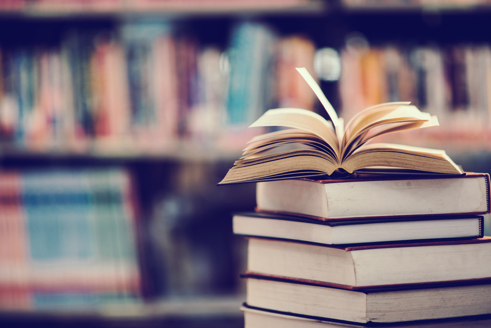 A pile of books in a library