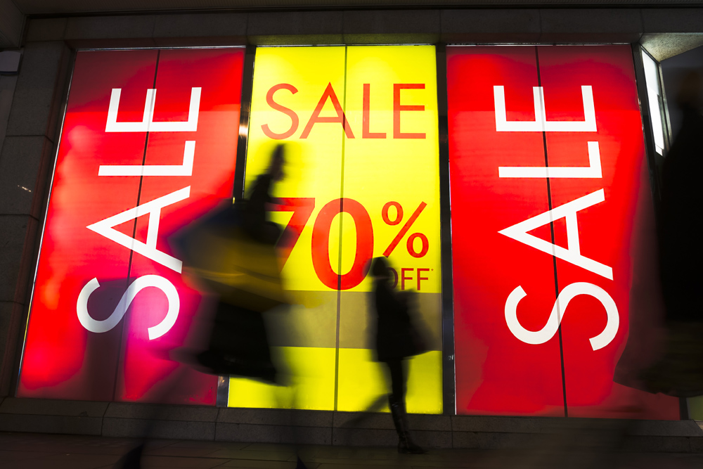 70% off sale sign in shop window