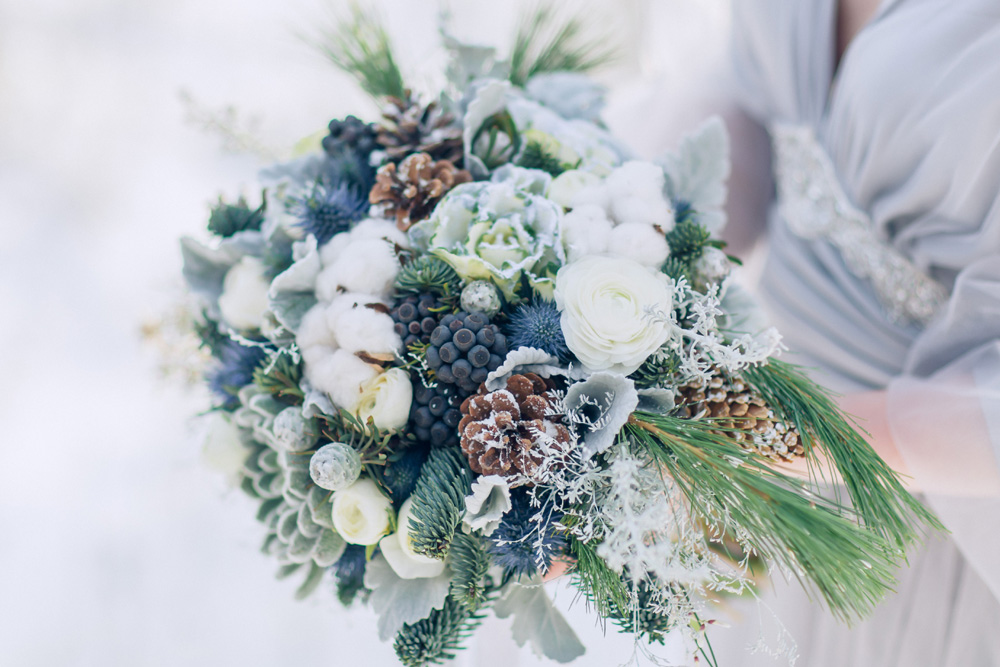 A wedding bouquet with winter blues and greens