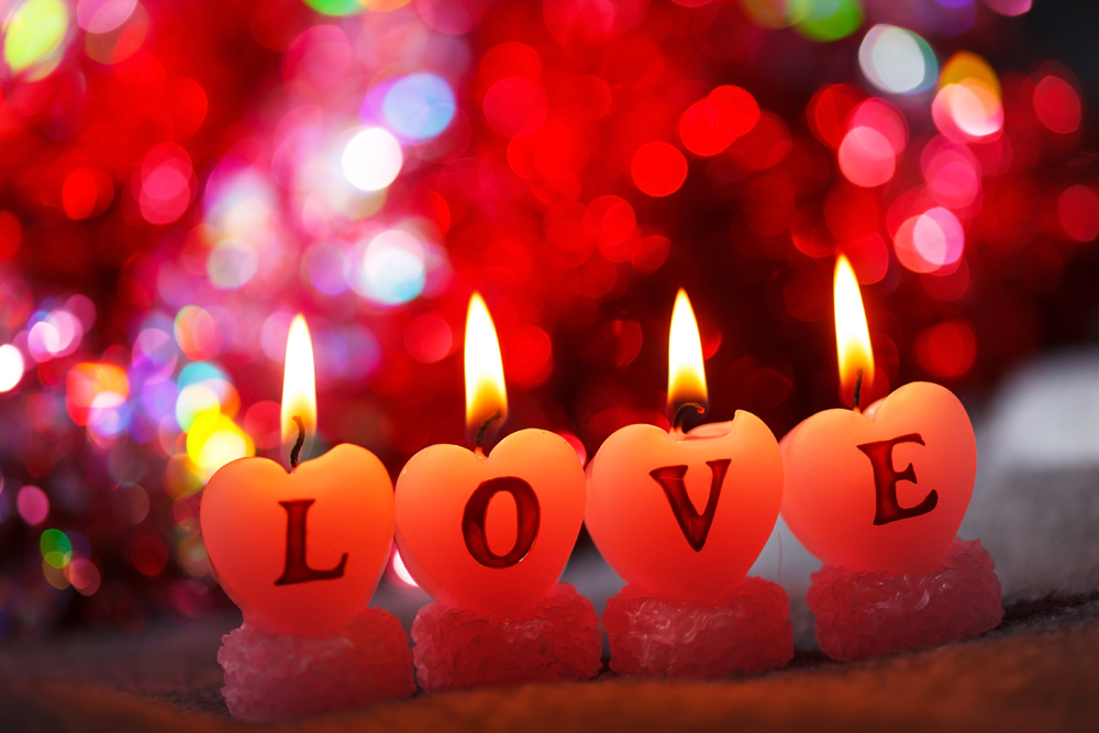 Candles at Christmas spelling out the word LOVE