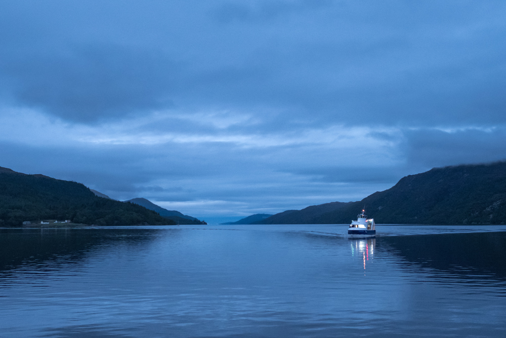Boat on the waters of Loch Ness at night