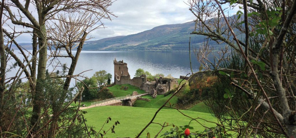 A ruined castle on the banks of a Scottish loch.