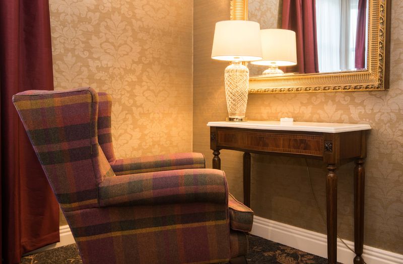 An armchair and desk at Kingsmills Hotel, Inverness