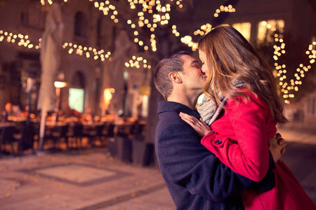 A Romantic Couple Kissing in Winter