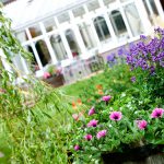 Beautiful flowers by a conservatory at Kingsmills Hotel, Inverness