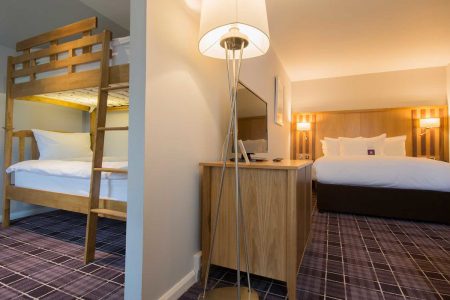 Double bed and bunk beds in a Luxury Family Room in Kingsmills Hotel