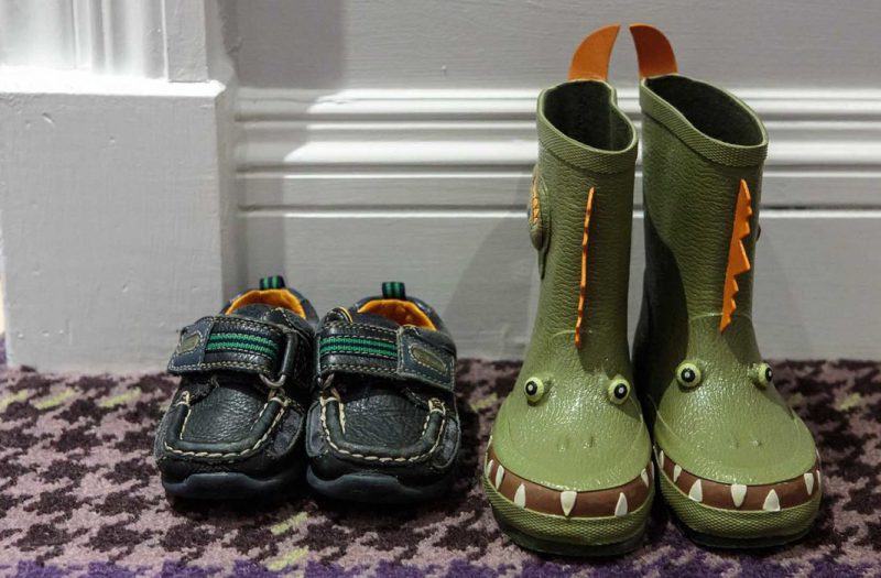 A pair of child's wellies and shoes outside a Luxury Family Room in Kingsmills Hotel