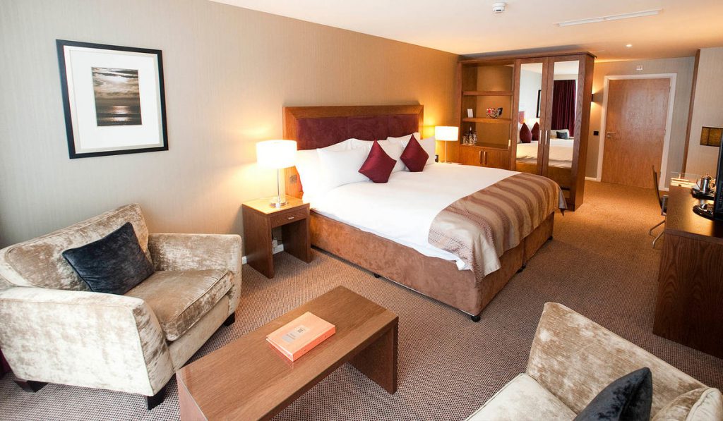 Living area and large double bed in a Retreat Family Room at Kingsmills Hotel offering luxury holidays with kids.