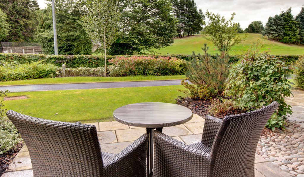 A view from a patio outside a Retreat Room at Kingsmills Hotel