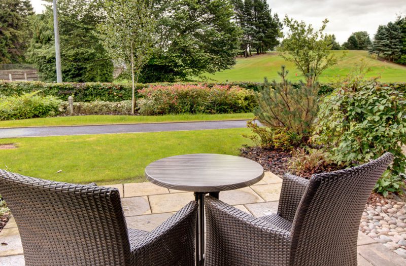 A view from a patio outside a Retreat Room at Kingsmills Hotel