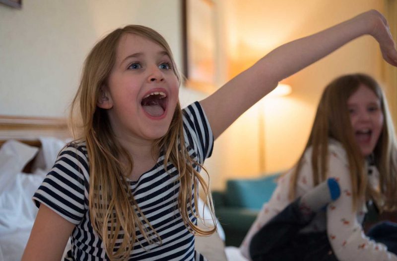 A delighted young girl in a family room at Kingsmills hotel