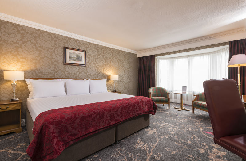 Luxurious accommodation in Scotland offers a large luxurious bed at Kingsmills Hotel, Inverness
