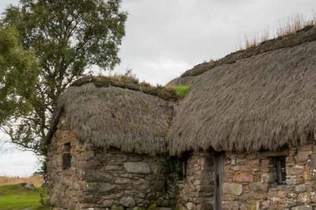 An old stone house with thatched roof at Culloden