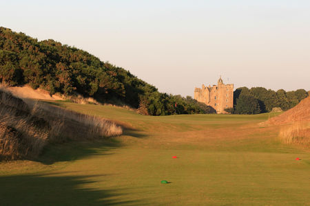 An Inverness golf course with a castle in the background