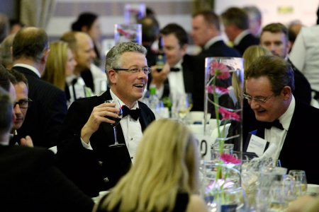 Dinner guests celebrating at an event