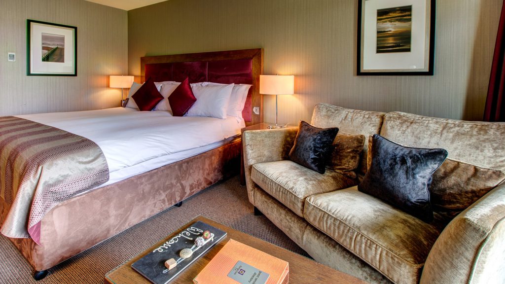 The Cocoon Room with bed and sofa at Kingsmills Hotel, Inverness