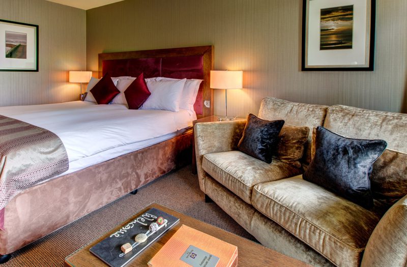 The Cocoon Room with bed and sofa at Kingsmills Hotel, Inverness
