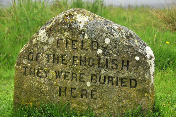 18th century stone memorial on Culloden Battlefield - a must-visit scotland winter attraction