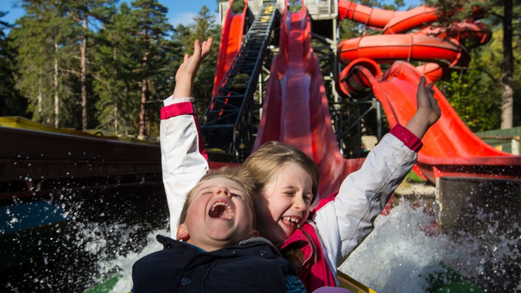 Kids on a water slide ride