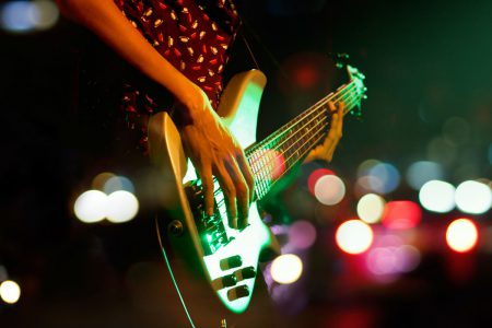 A person on stage playing a guitar