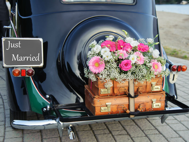 "Just Married" car with cases packed