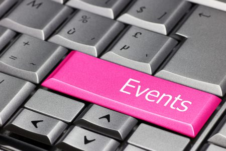A large pink Events button on a computer keyboard