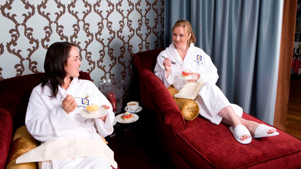 Two ladies enjoying cake on a spa day package at Kingsmills Hotel, Inverness