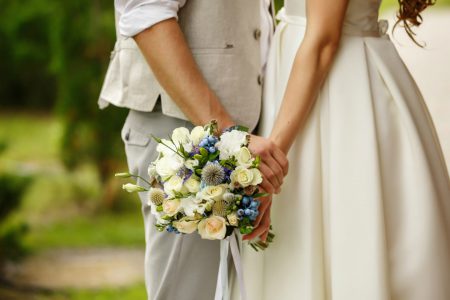 Bride & Groom Holding Hands in Garden Wedding