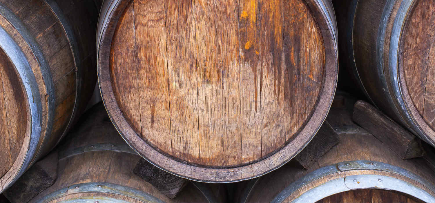 A wooden whisky barrel in storage