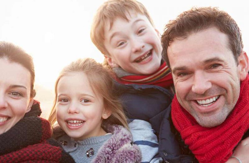 A happy family enjoying being outside on holiday