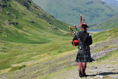 A Highlands piper playing in the Highlands