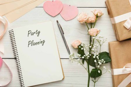 A notebook with "party Planning" on the cover