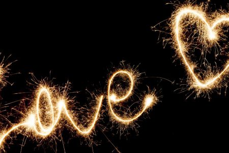 Sparklers writing Love in the air