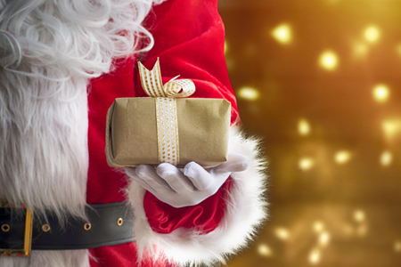 Santa Claus holding a Christmas gift