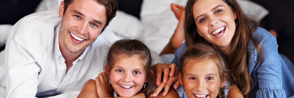 Parents and children in a hotel room