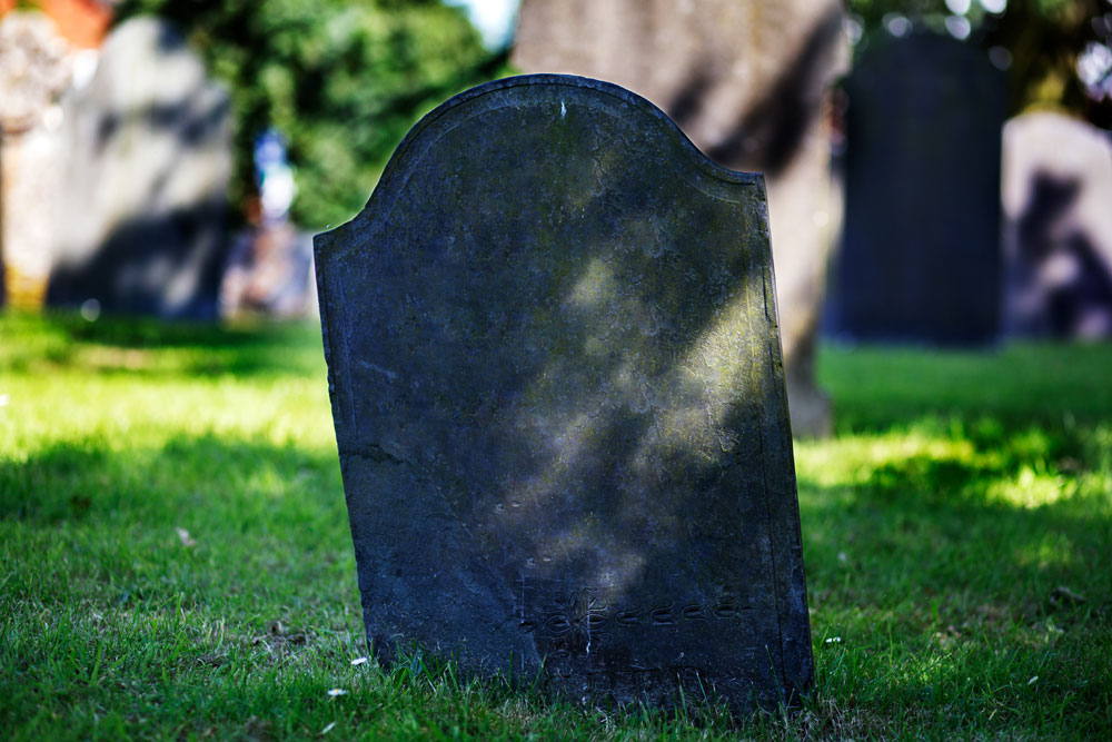 Old gravestone at a burial ground