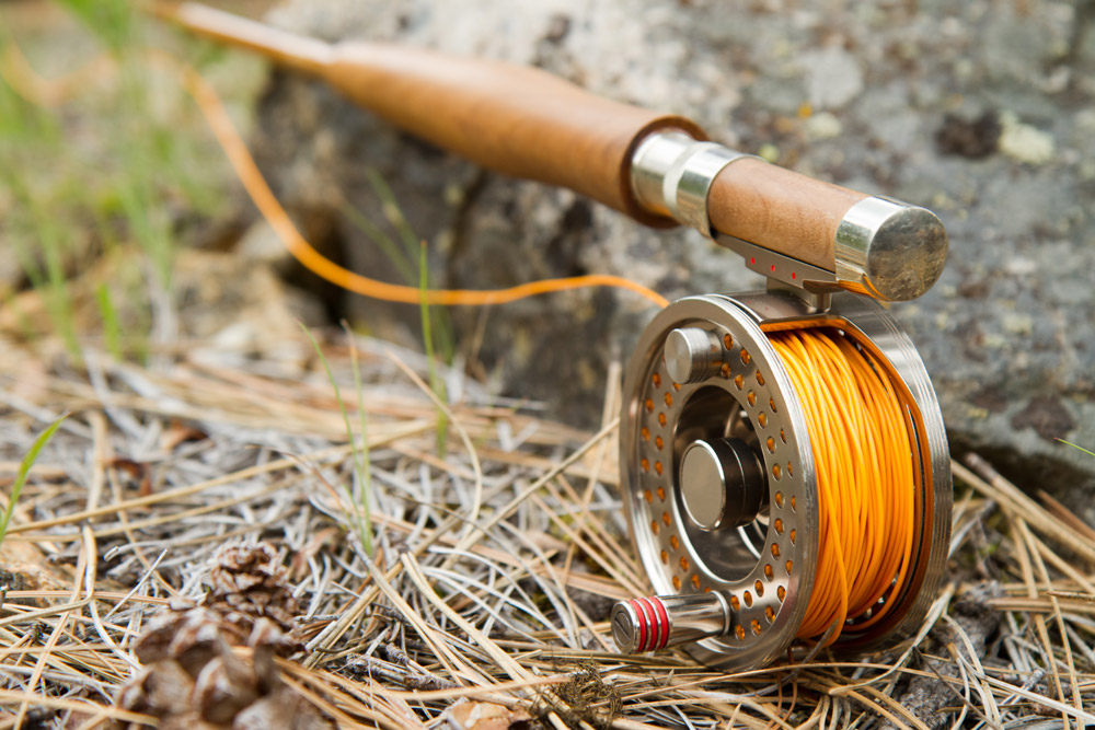 Close up of fishing reel on the ground