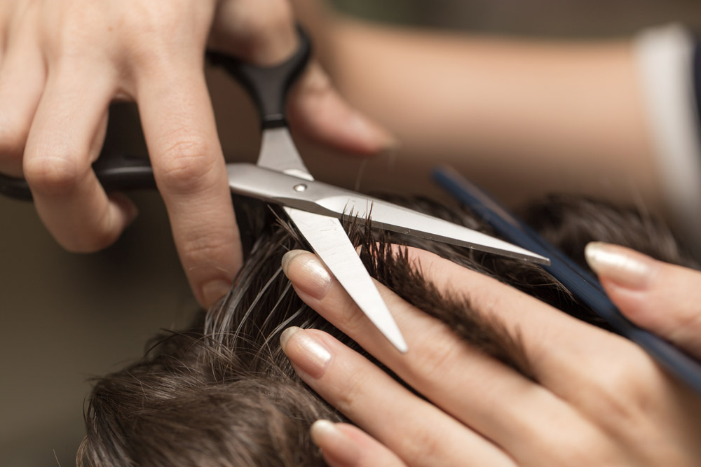 Close up of man getting his hair cut