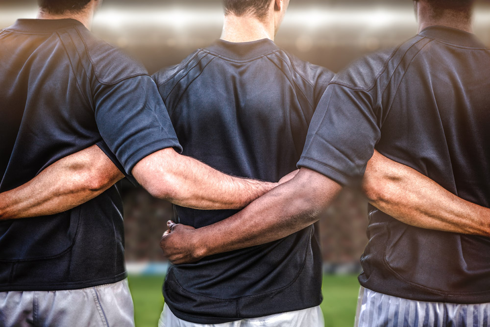 Rugby players in a row before a match