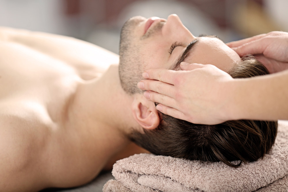 Man having spa facial treatment