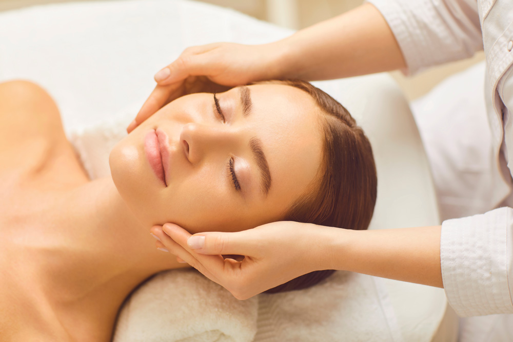 Woman having a spa facial treatment