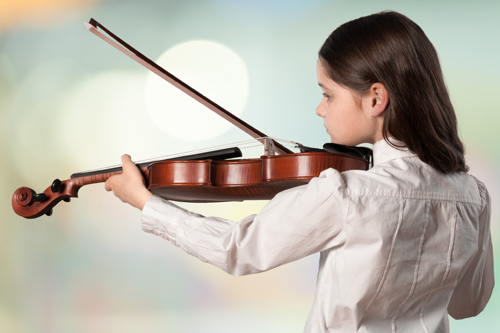 A child playing a violin