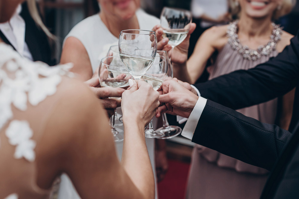 Group celebrating with Champagne at a wedding