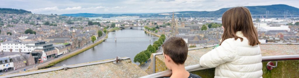 Two children admiring views from Inverness Castle