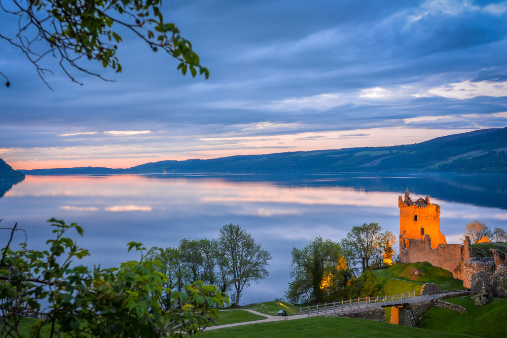 View of Loch Ness and Urquhart Castle in the evening