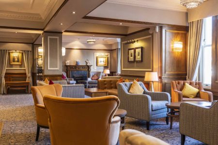 Armchairs and sofas in the reception area in the Kingmills Hotel